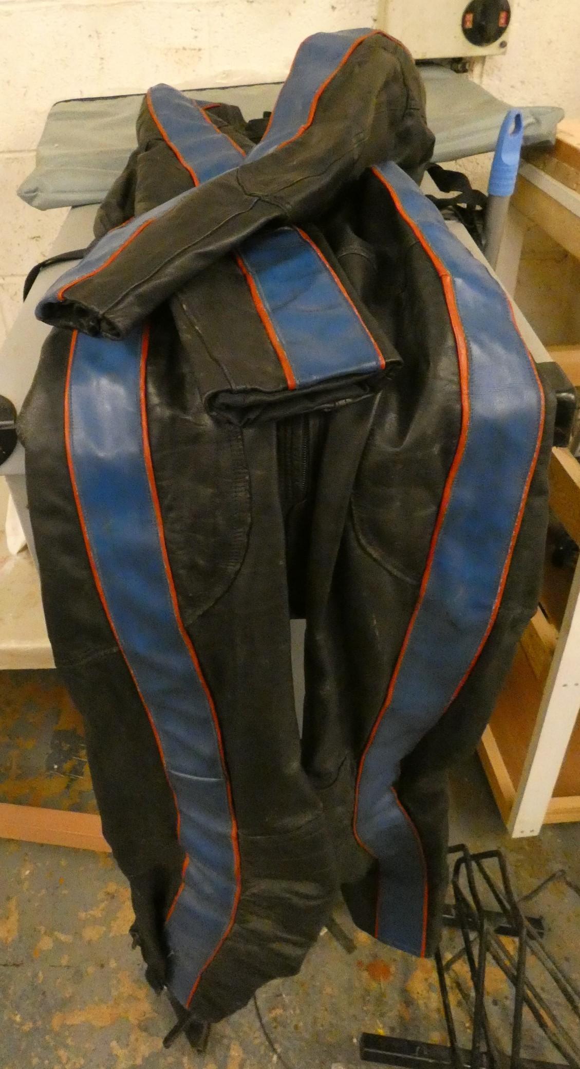 A leather one piece racing suit, fitted a 5 foot 10 inch male