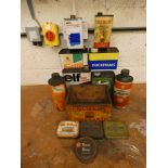 A collection of tins including Lovejoy Shock Absorber Oil.