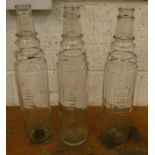 Three Essolube glass bottles (3).