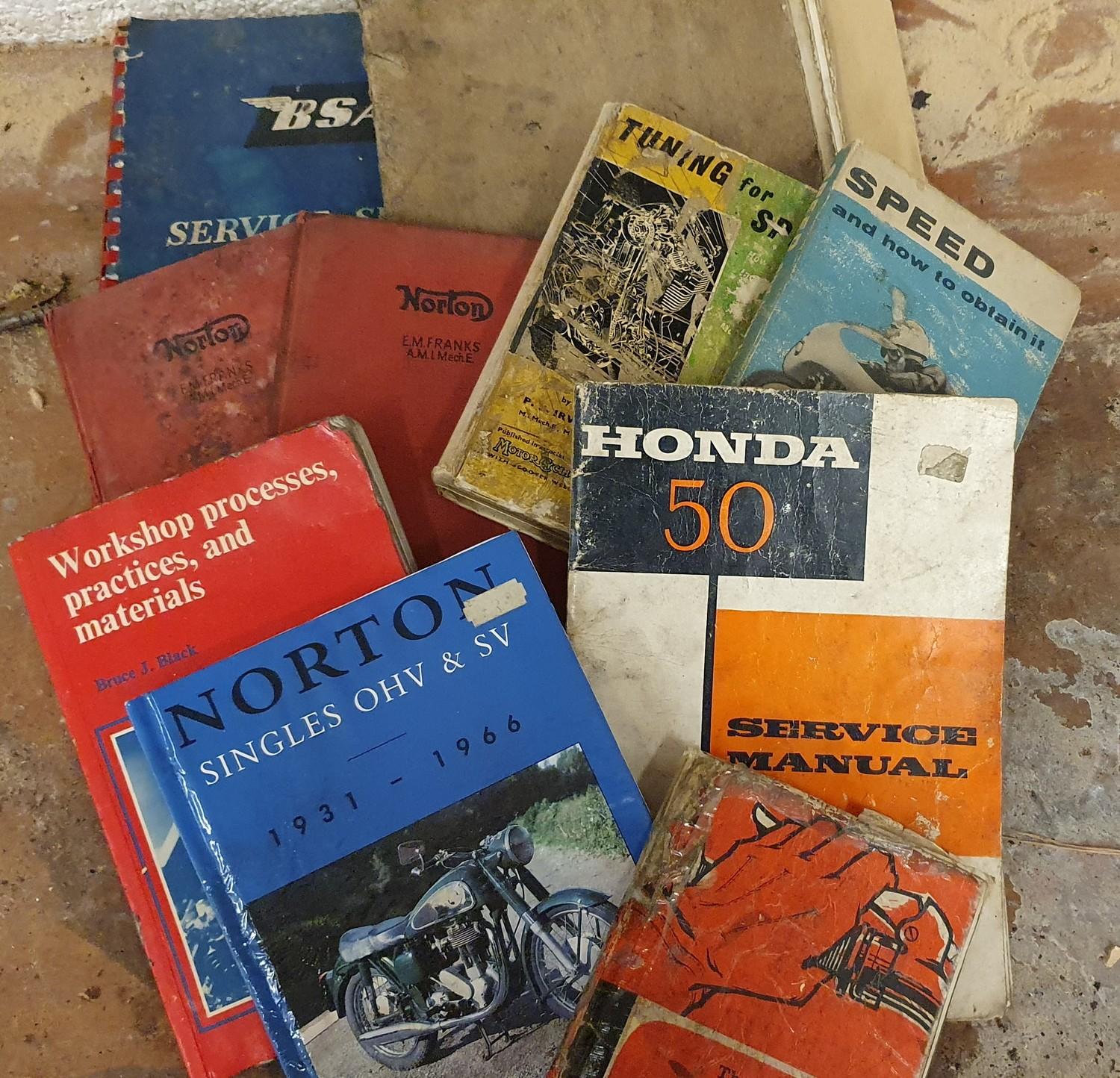 A Honda 50 service manual, together with various BSA and Norton manuals.