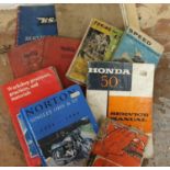 A Honda 50 service manual, together with various BSA and Norton manuals.