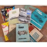 A collection of motorcar manuals, including Ford Transit , Mini MkII and Austin 1800 MkII.