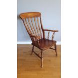 An Edwardian beech high back kitchen chair, with swing arms, ht 105 cm.