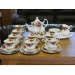 A Royal Albert 'Country Roses' tea service to include, eight cups, nine saucers, three side