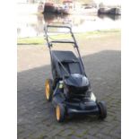 A petrol driven, self propelled Mcculloch lawnmower, with a Briggs and Stratton 625E series