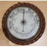 An Edwardian oak rope twist Aneroid barometer and other mantle clocks