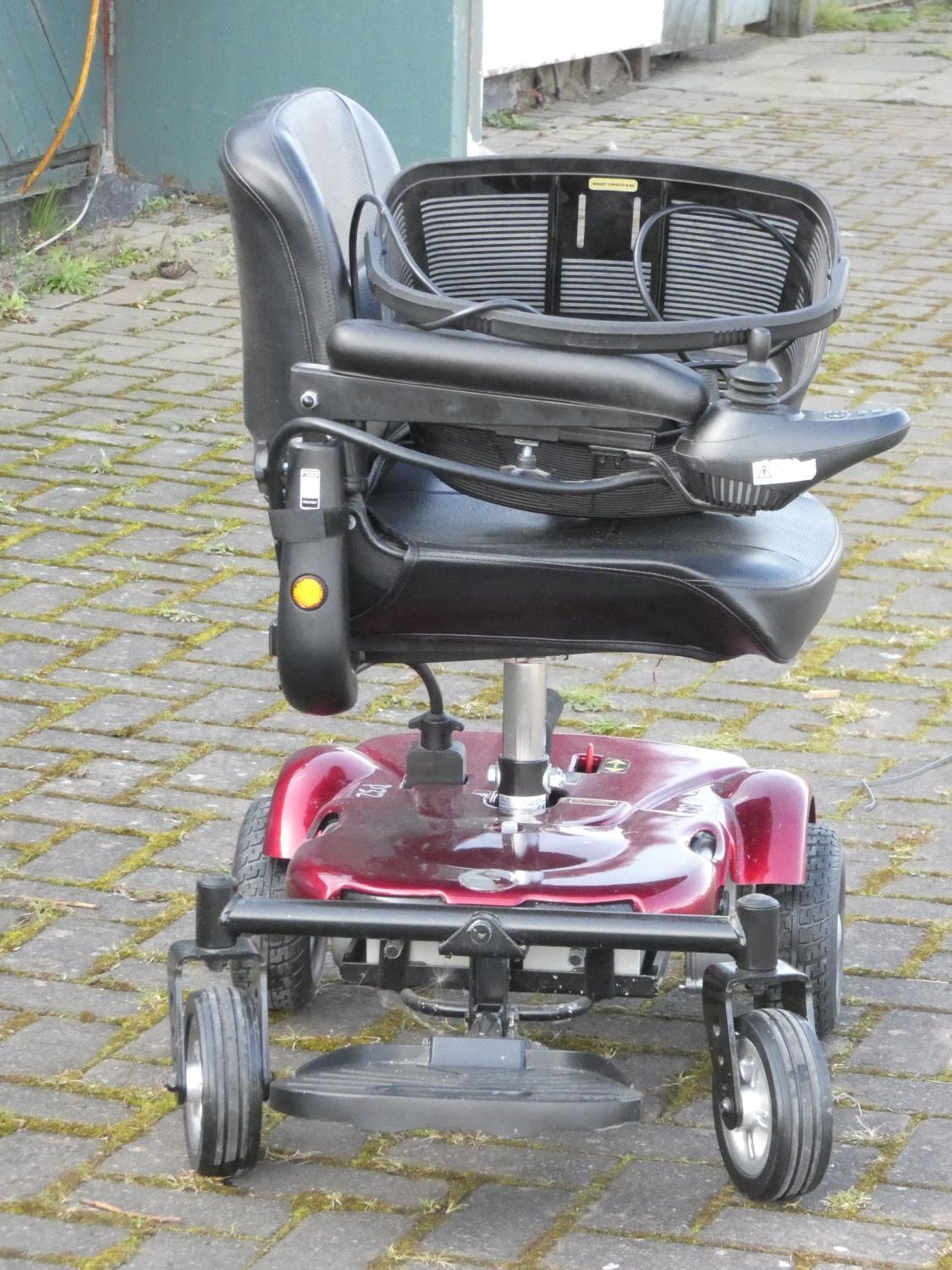 A Rascal battery operated mobility chair, complete with battery charger