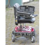 A Rascal battery operated mobility chair, complete with battery charger