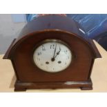 A mahogany mantle clock with white enamel dial and other clocks