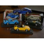 A collection of Burago die-cast model cars, to include- Bugatti Atlantic 1936 (boxed), Jaguar XK 120