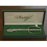 A cased Davidoff fine cigar cutter