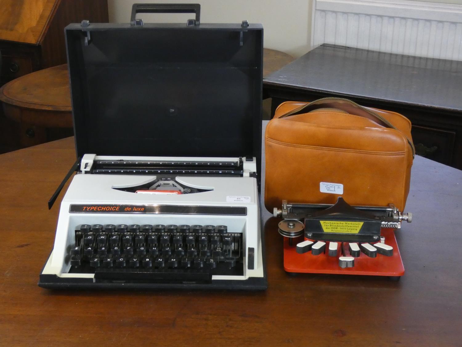 A cased typewriter 'Typechoice De Luxe' together with a 'Mini Picht' braille typewriter. (2)