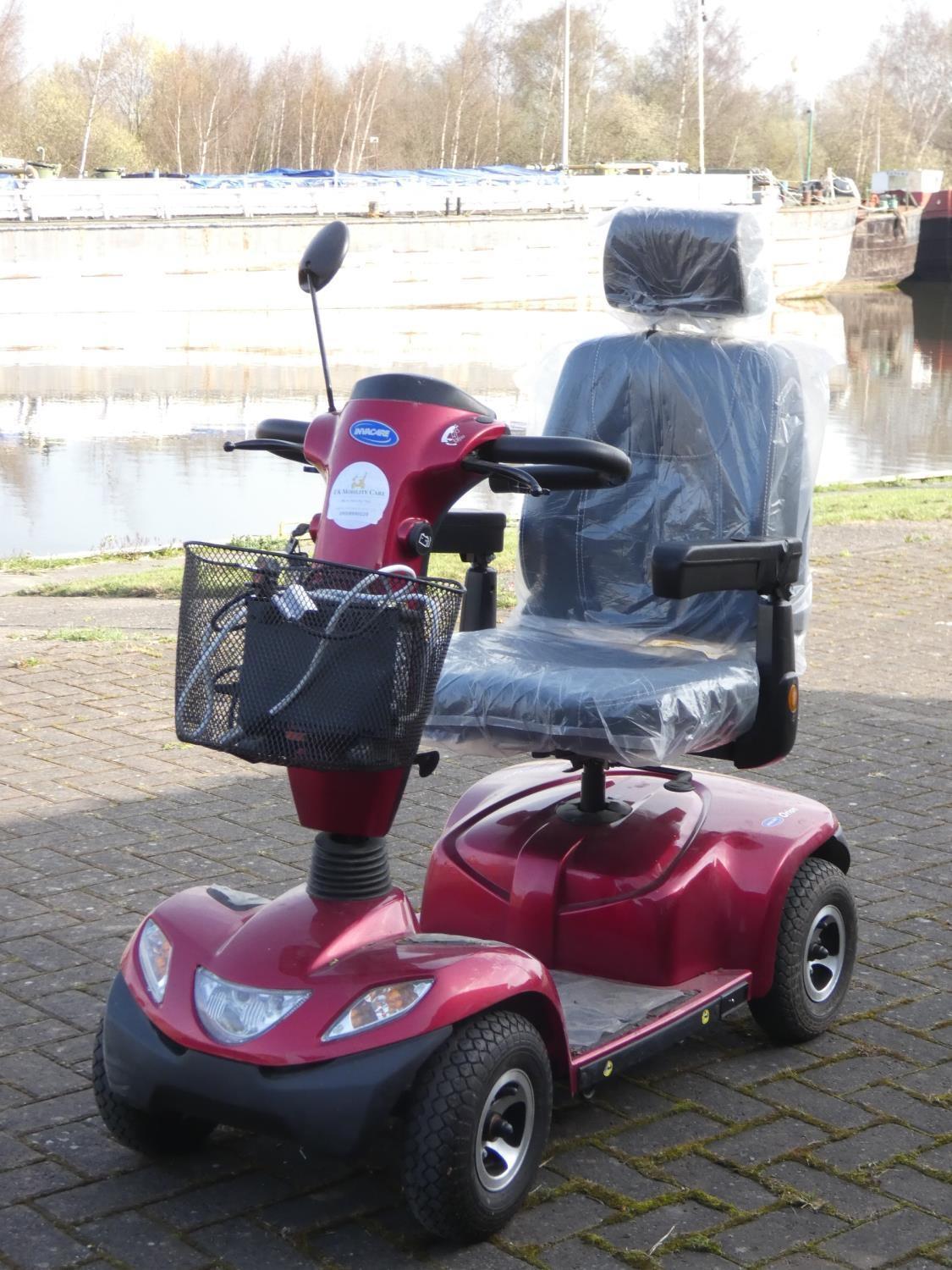 An Invacare Orion four wheeler mobility scooter complete with, battery charger