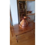 A Victorian copper 2 gallon wide bottom flagon, a coffee table and a mirror (3).