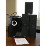 A Teufel 80 Home Theater speaker system with subwoofer