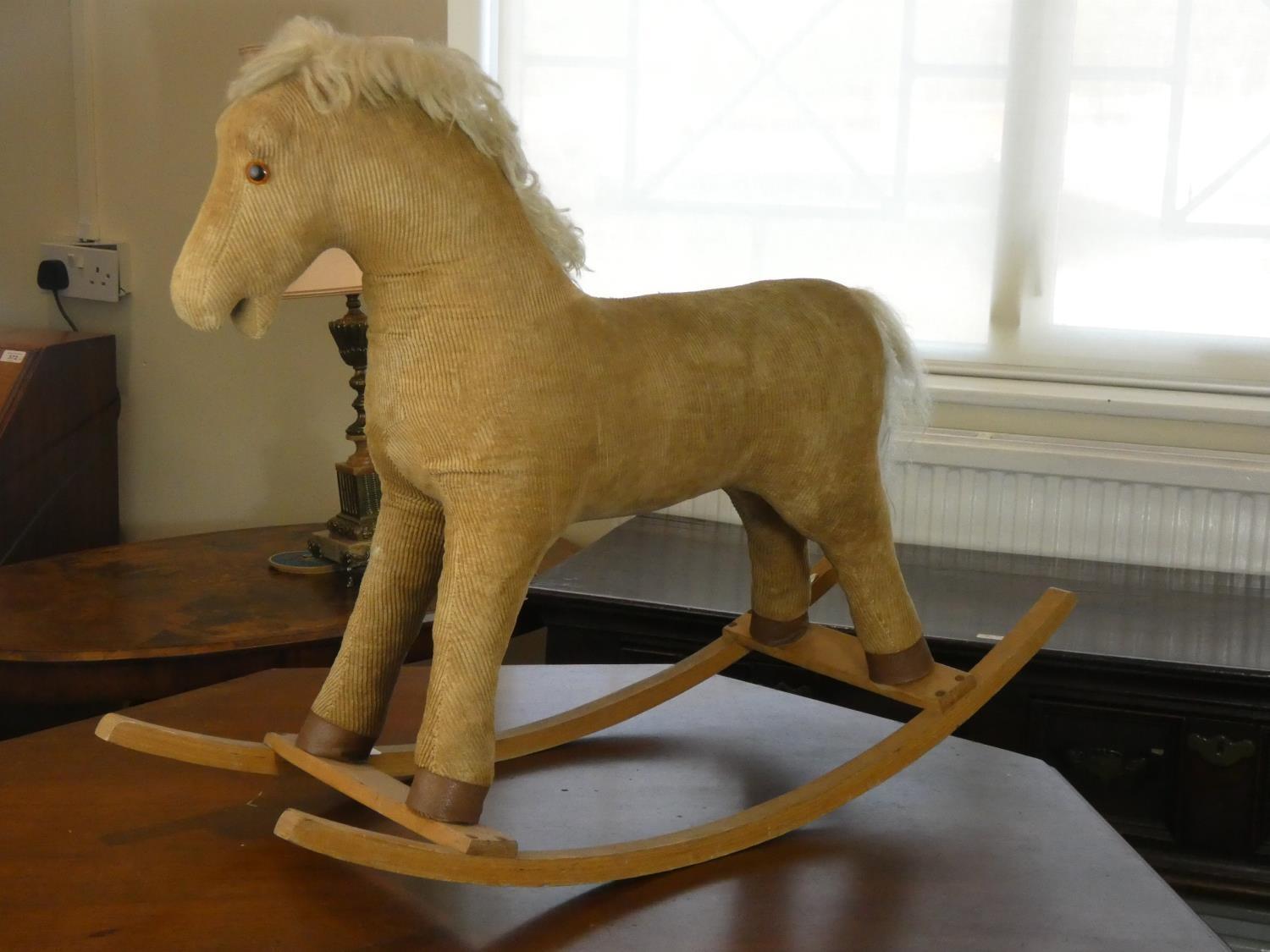 A child's corduroy rocking horse