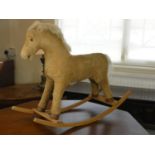 A child's corduroy rocking horse