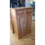 A pine cabinet, with two frieze drawers over two cupboards doors, 120 x 74 x46 cm, together with a