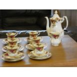 A Royal Albert 'Country Roses' coffee service consisting of, six cups, six saucers, six side plates,