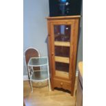 A pine glazed cabinet, with drwaer, 135 x 45 x 40 cm together with 2 white painted wrought iron