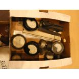 Various volt meters, slide rulers, cast metal wax badge sealer
