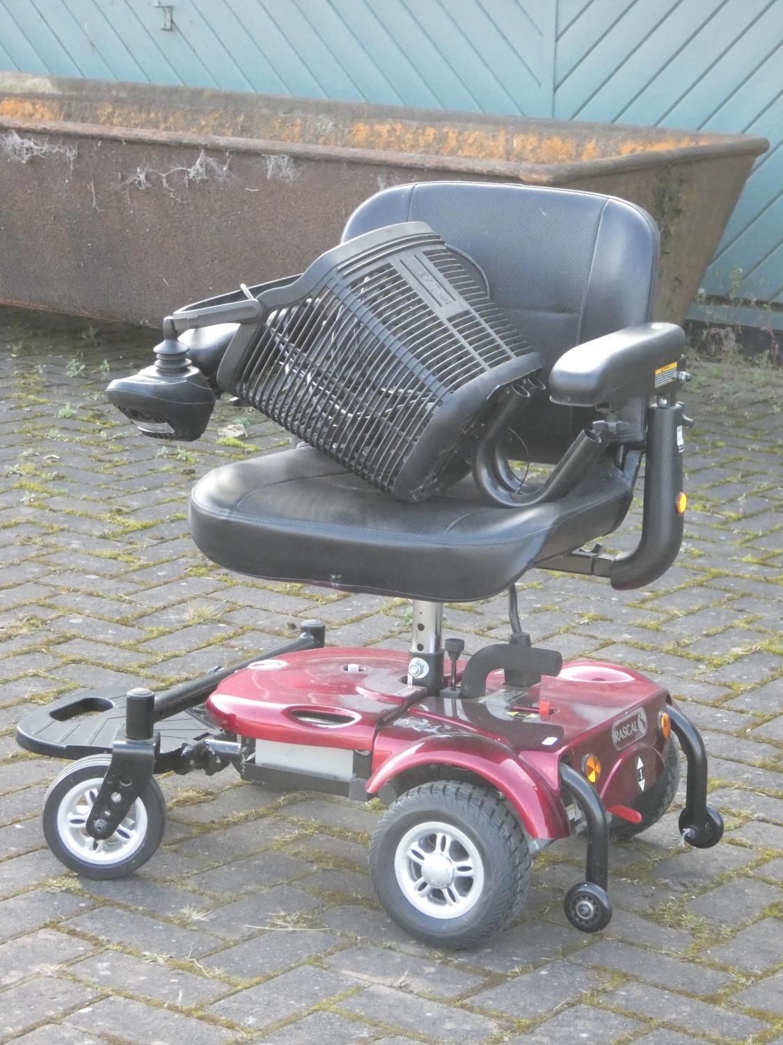 A Rascal battery operated mobility chair, complete with battery charger - Image 2 of 6