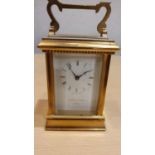 A Mappin and Webb brass quartz carriage clock with presentation inscription plaque, boxed