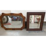 An Edwardian oak framed bevelled glass mirror, 67 x 92 cm and another bevelled mirror (2).