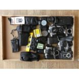 A collection of cameras including a Nikon F50, a Konica C35 and a Konica Auto S2 along with