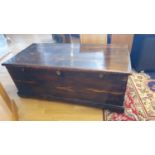 A stained pine blanket chest with 3 locks, opening to reveal a candle box with drawer below. 117 x