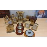 A collection of brass and other carriage clocks and an anniversary clock