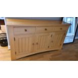 A pine side cabinet, 3 frieze drawers over 3 panelled doors, 155 x 42 x 87 cm.