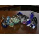 A collection of eleven modern glass paperweights