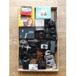A collection of cameras including a Praktica Tova, Meikai AR-4367 and Kodak Instamatic 104 along