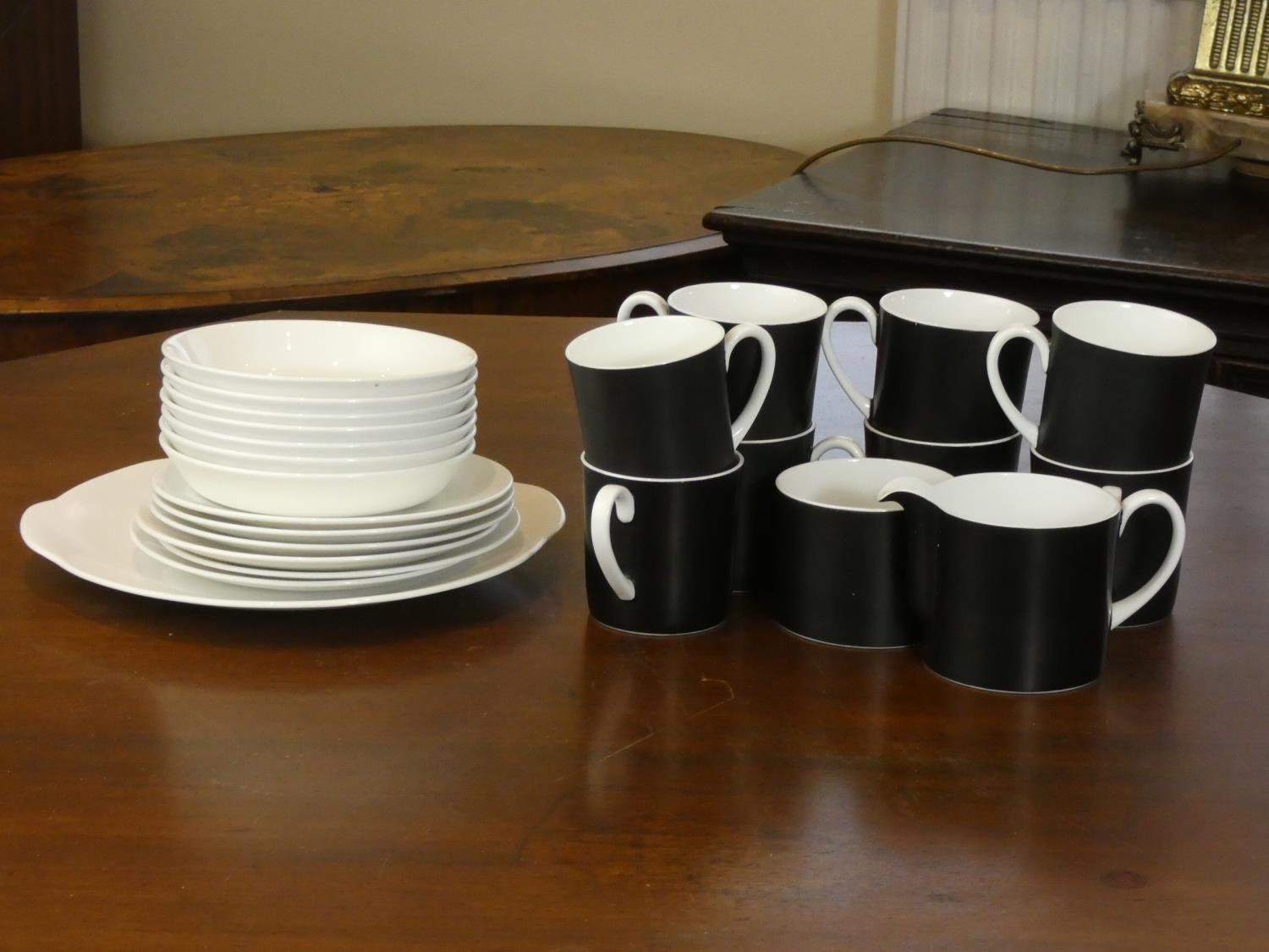 A Susie Cooper Contrast (C2068) including- eight tea cups, seven saucers, six side plates, serving