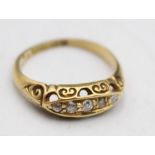 An Edwardian 18ct gold five stone boat shape diamond ring, Birmingham 1906, size L and an 18ct