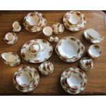 A Royal Albert 'Country Roses' dinner service including, an oval platter (34x27 cm), serving