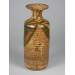 Unknown, a brown glazed stoneware vase with narrow neck, ribbed with dark brown and green glaze,