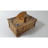 An early 20th century Swiss brass and blue glass singing bird musical box,