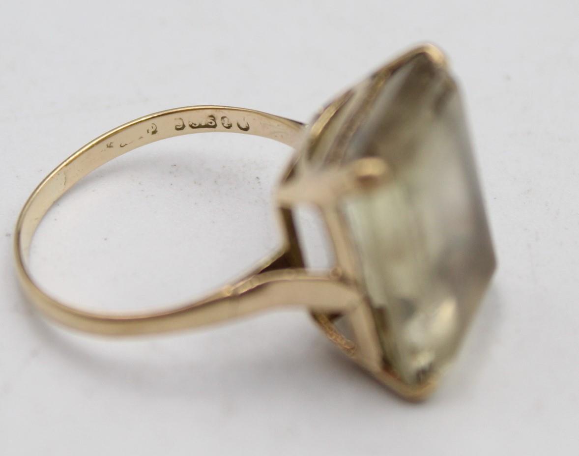 A 9ct gold and smokey quartz dress ring, London 1966, claw set with a step cut stone, 17 x 12 cm, - Image 5 of 5