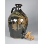 Ron Green of Lincoln, a large vase blue glaze wine ewer, with brown swirl to the front,