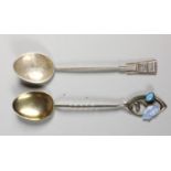 Charles Horner, a silver, turquoise and enamel spoon, Chester 1908, with scroll terminal and gilt