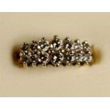 A 14k diamond ring, claw set with two rows of brilliant cut stones, total weight approximately 1 ct,