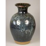 Unknown, a mottled blue glazed baluster vase, height 29 cm.
