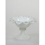 A Victorian white overlaid glass pedestal dish with scallop border, height 12 cm.