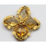 An early 19th century gold and citrine quatrefoil brooch, set with diamond shape stones, 40 x 37 mm.