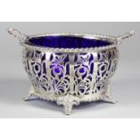 A silver sugar basket, by Mappin & Webb, Birmingham 1927, with pierced scroll decoration,