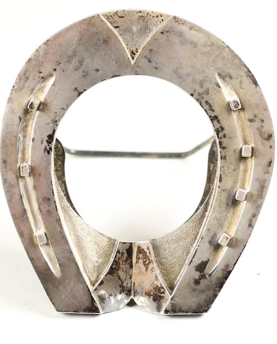 A Victorian silver novelty pocket watch holder, Birmingham 1892, in the form of a horse shoe, 11 cm,