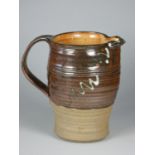 Charles Bound (b.1939), a stoneware brown glazed jug with abstract design, height 20 cm