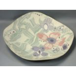 Margery Clinton, a stoneware dish of irregular square form, painted with flowers and abstract